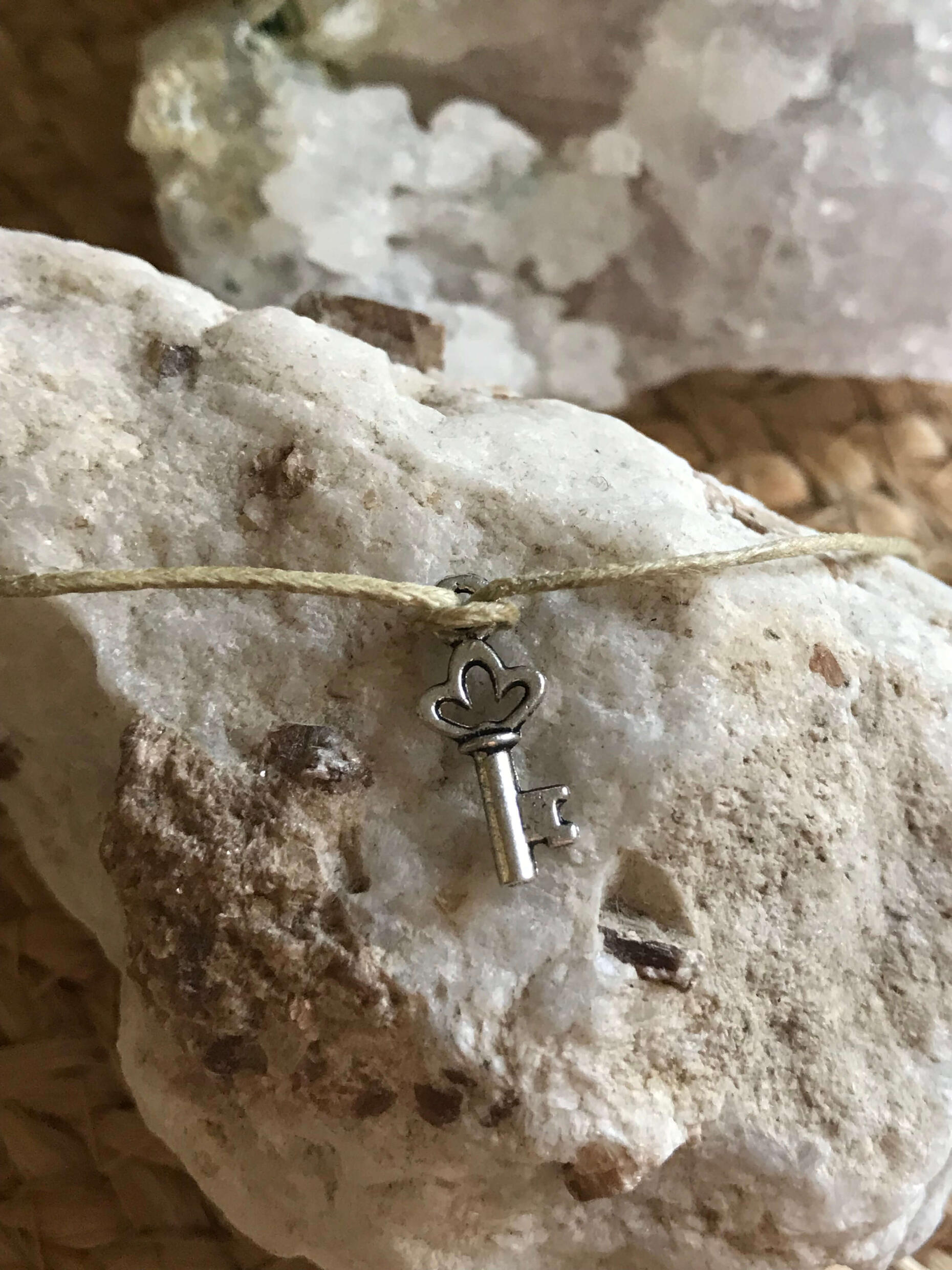 Wish Bracelets Handmade in Scotland New Beginnings wish bracelet with key displayed on a crystal