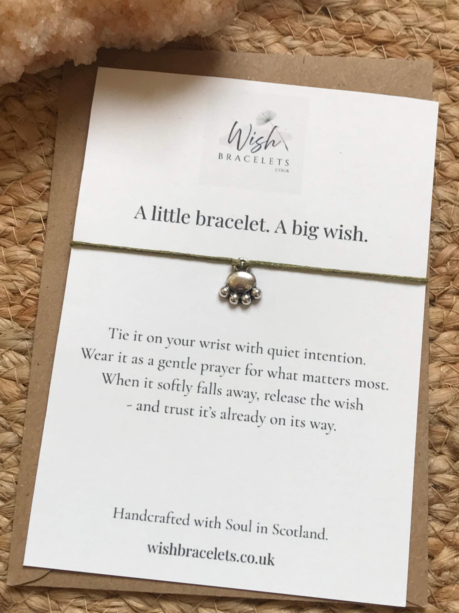 The Companion Wish Bracelet paw print wish bracelet with olive green cord